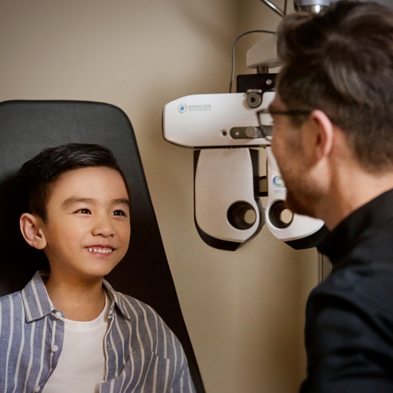 Optometrist working with a child