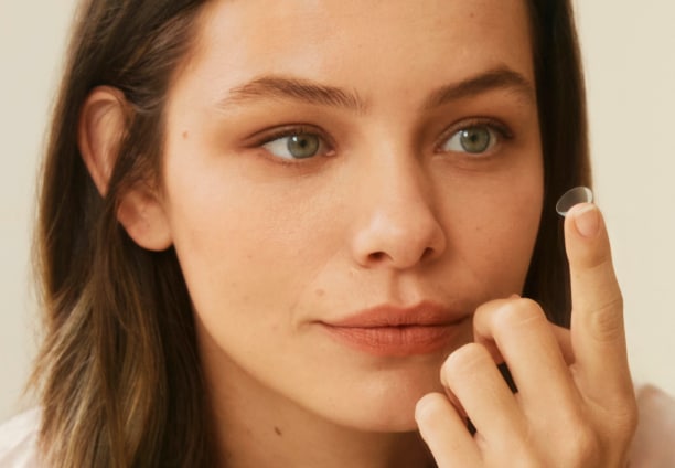 A woman putting a contact lens