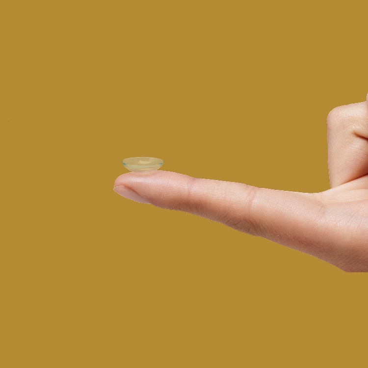 Finger holding Contact Lens